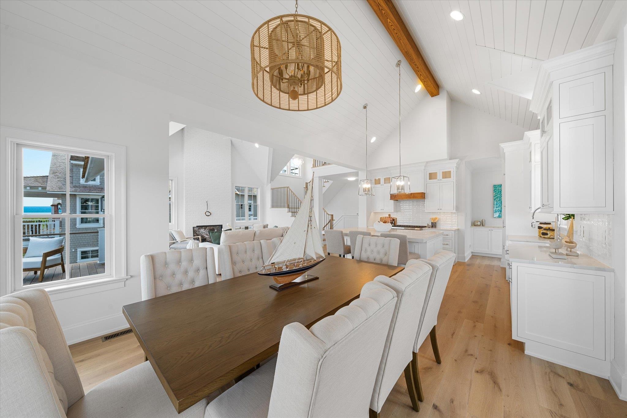 155 112th Stone Harbor, NJ 08247 - Photo 7 of 49 a living room with furniture a clock and a large window