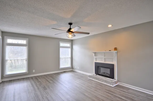 a view of livingroom window wooden floor and front door
