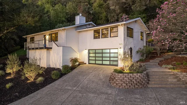a front view of a house with garden