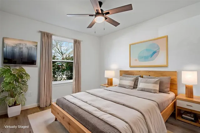 a bedroom with bed and a window