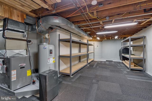 a view of a patio with lawn chairs next to a yard