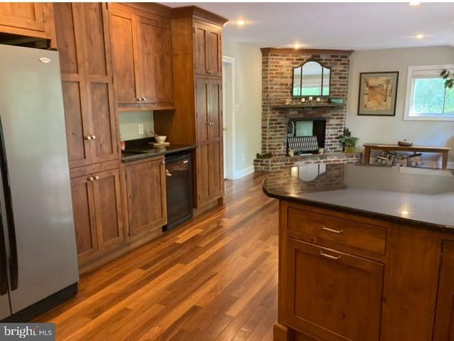 a kitchen with a sink and a stove top oven