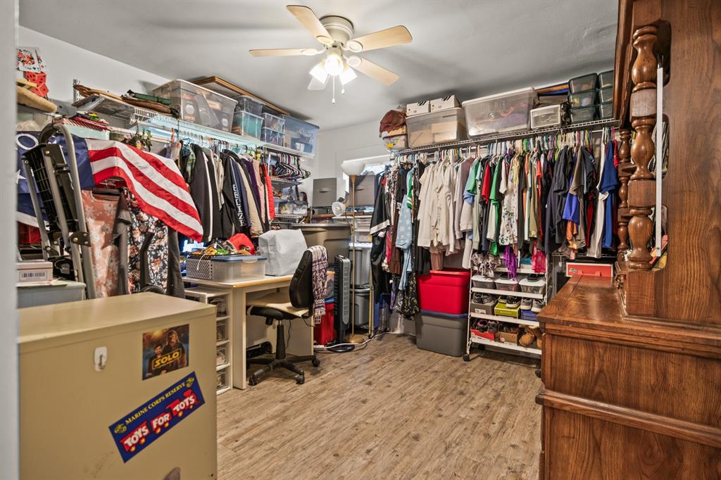 103 South Sun Camp Road White Oak, TX 75693 - Photo 34 of 40 a view of walk in closet with clothes and shoes
