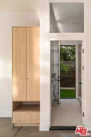 a view of front door with wooden floor