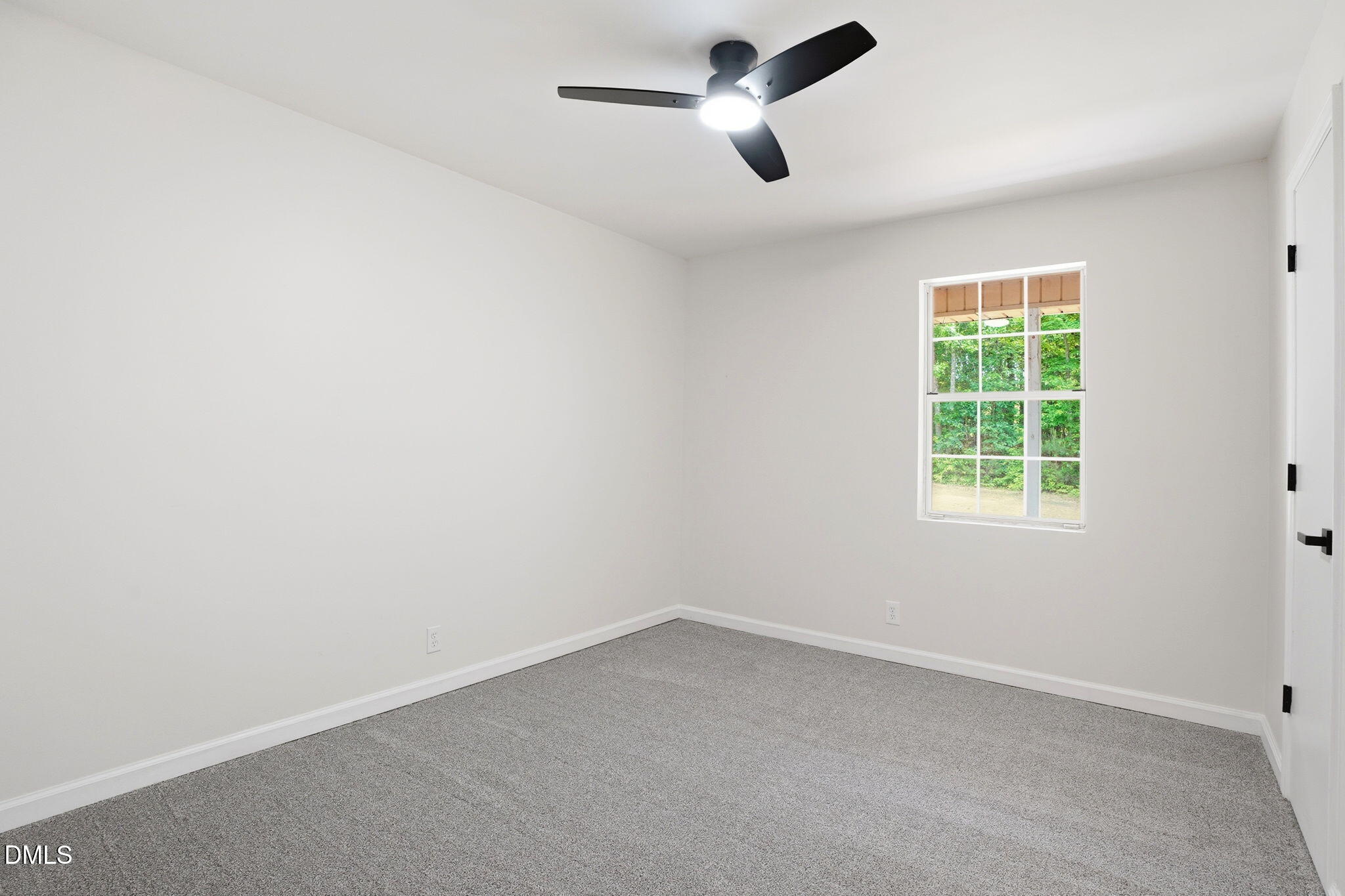 3602 Harrison Road Castalia, NC 27816 - Photo 35 of 48 an empty room with a window