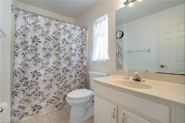 a bathroom with a sink toilet and mirror