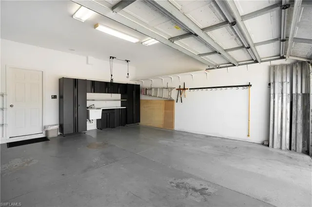 a view of a kitchen with a stove and a refrigerator