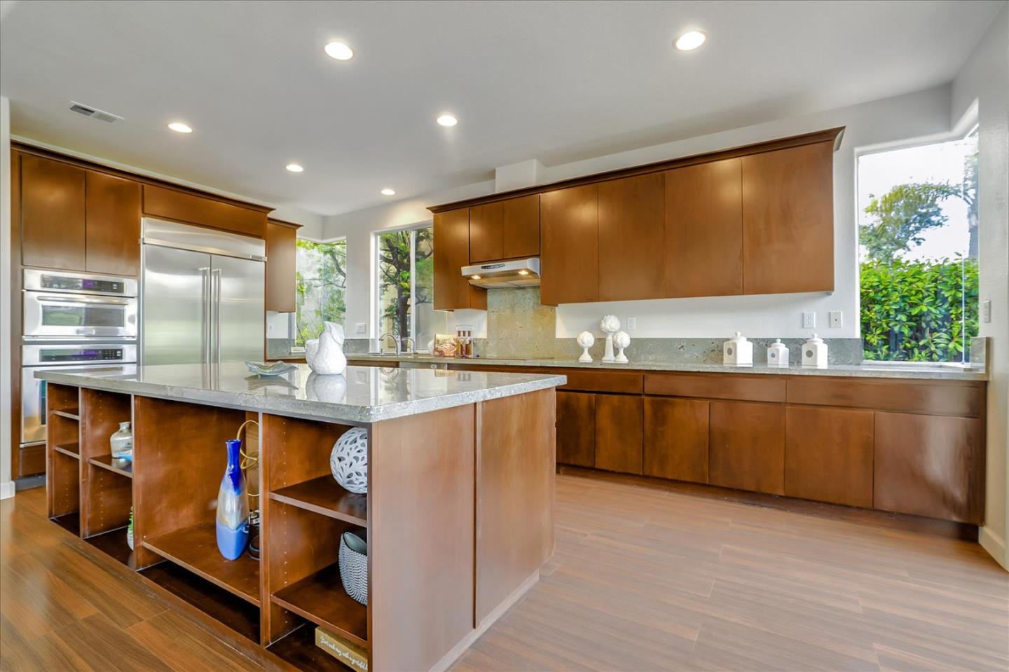 5803 Killarney Circle San Jose, CA 95138 - Photo 16 of 57 a kitchen with stainless steel appliances granite countertop a sink counter space cabinets and a large window
