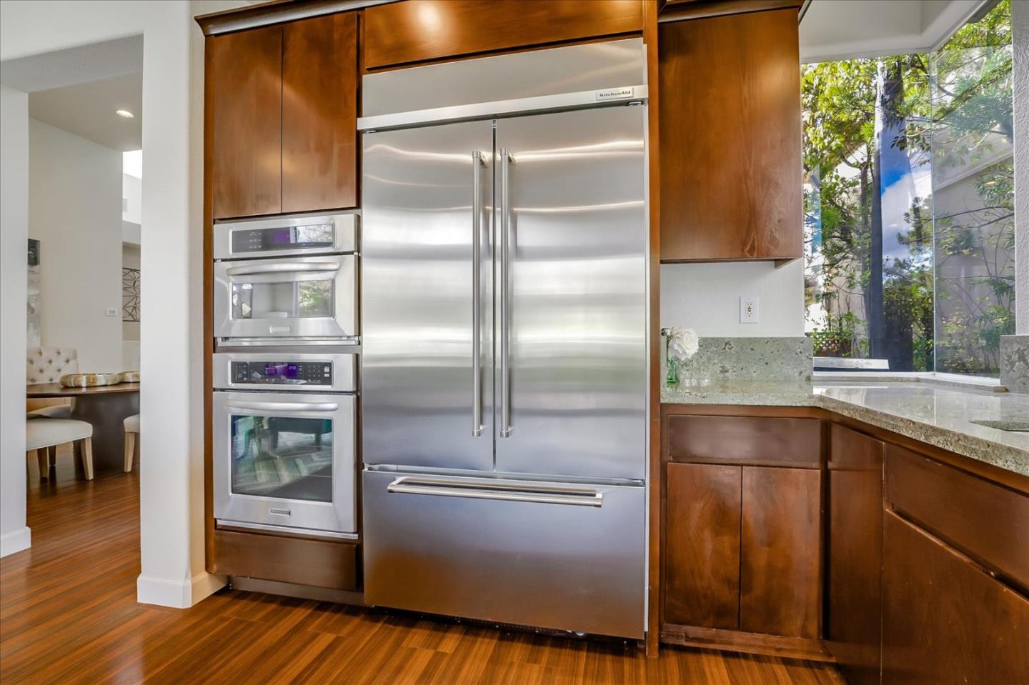 5803 Killarney Circle San Jose, CA 95138 - Photo 17 of 57 a kitchen with kitchen island a counter top space a sink and stainless steel appliances