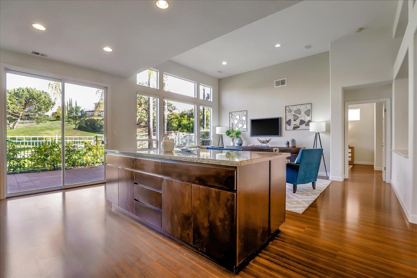 5803 Killarney Circle San Jose, CA 95138 - Photo 20 of 57 a large kitchen with stainless steel appliances a large counter top a stove and a wooden floors