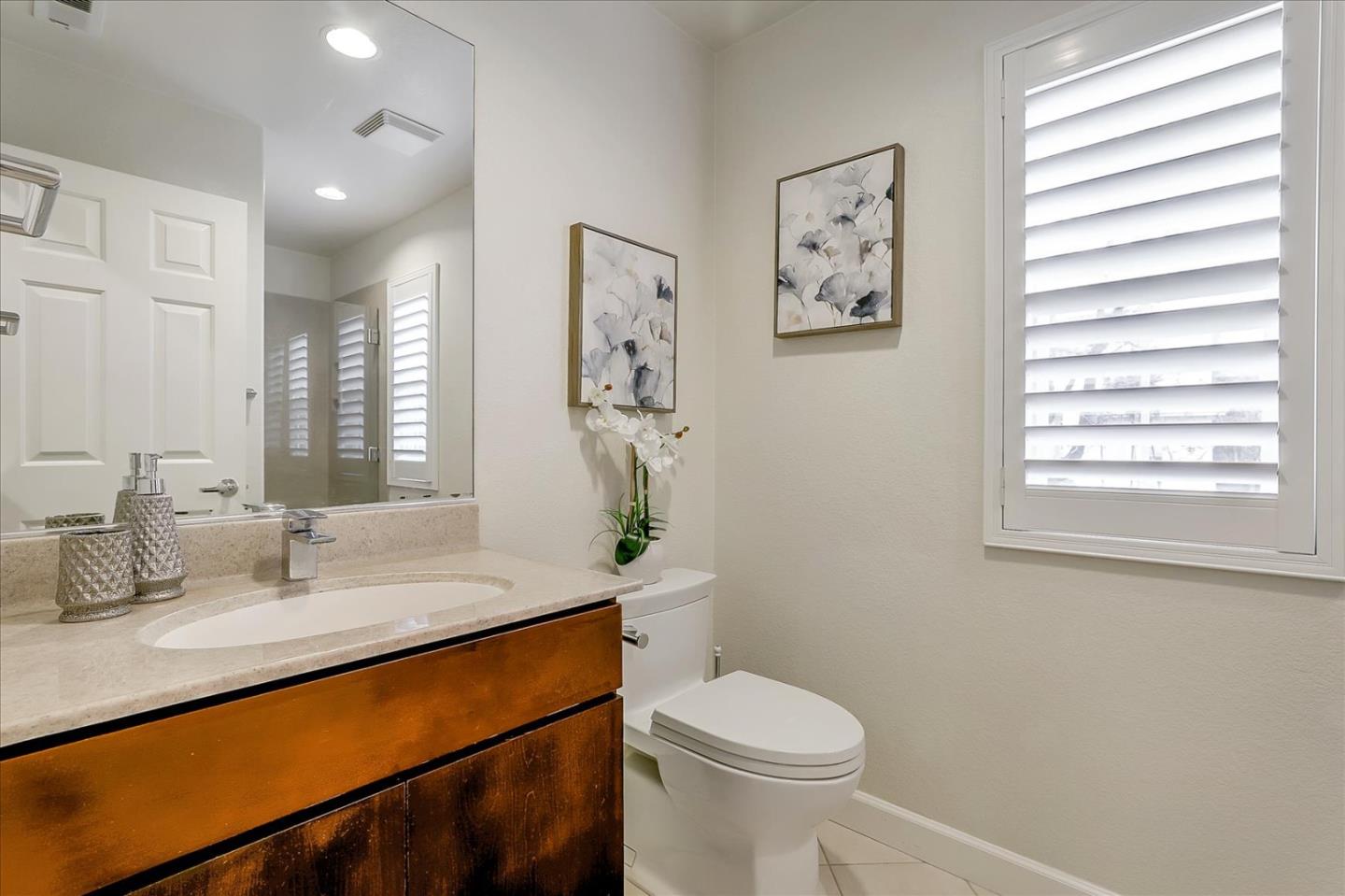 5803 Killarney Circle San Jose, CA 95138 - Photo 23 of 57 a bathroom with a sink a toilet and a window