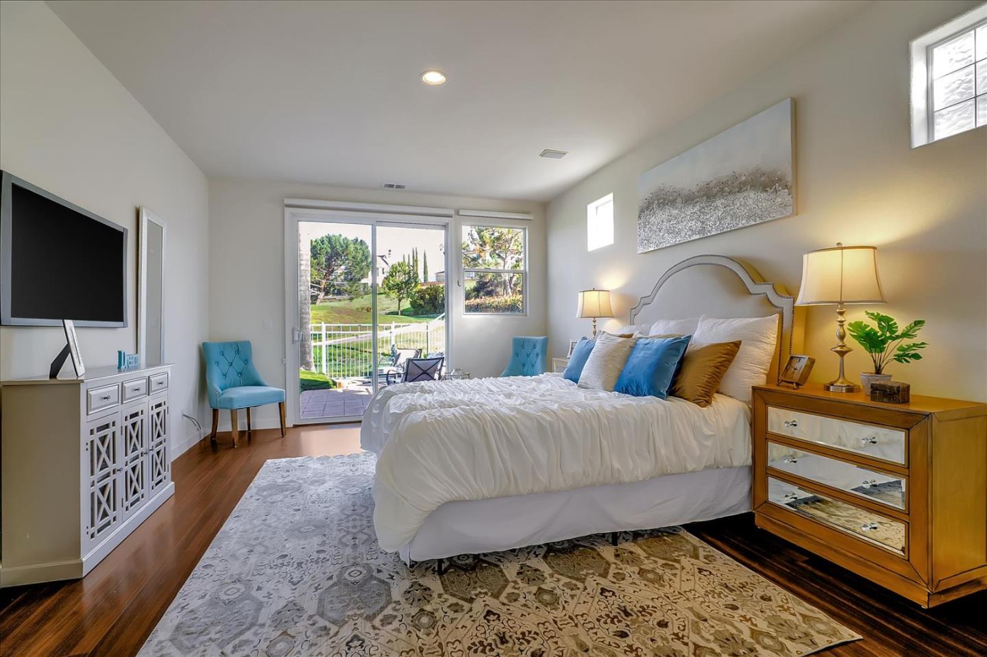 5803 Killarney Circle San Jose, CA 95138 - Photo 26 of 57 a bedroom with a bed and flat screen tv