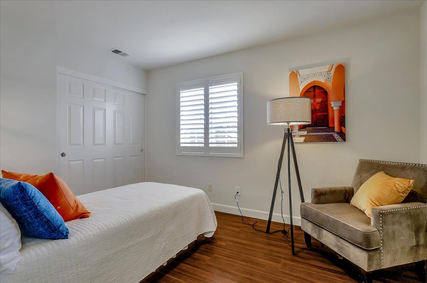 5803 Killarney Circle San Jose, CA 95138 - Photo 36 of 57 a bedroom with a bed and wooden floor