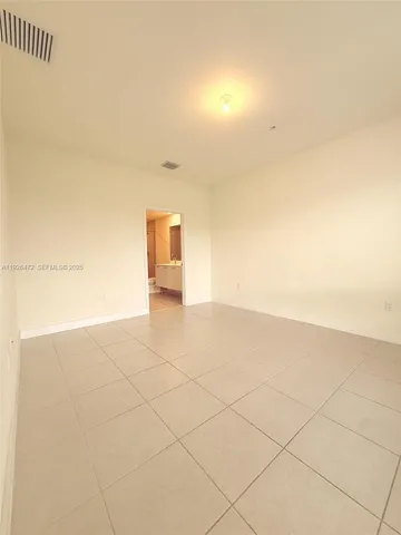 a bathroom with a double vanity sink toilet mirror and bathtub