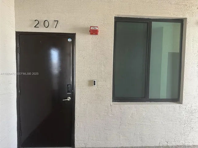 a large white kitchen with white cabinets and a stove