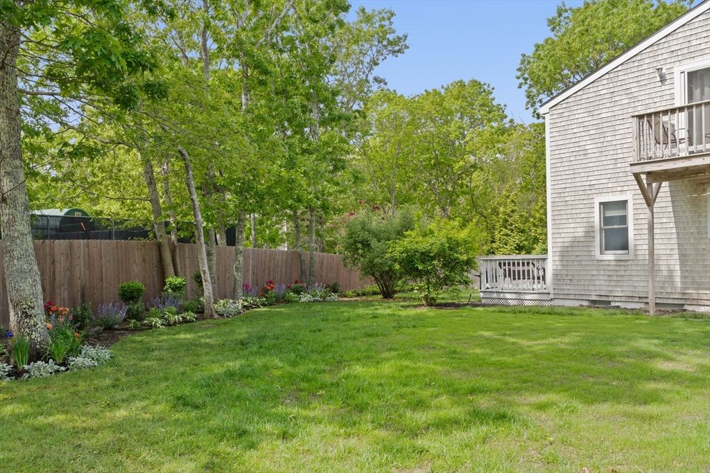 4 Hye Lane Edgartown, MA 02539 - Photo 37 of 41 a view of a backyard with a garden