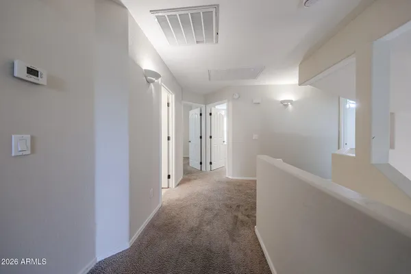 a white toilet and tub sitting next to a bathroom sink