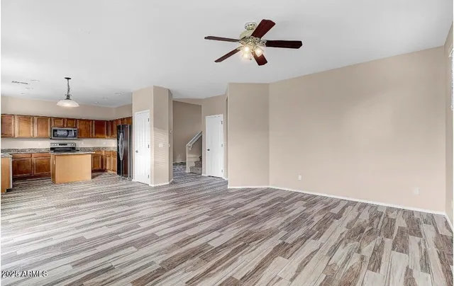 a view of kitchen with wooden floor and window