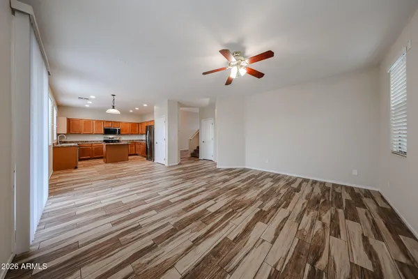 a view of kitchen and hall with wooden floor