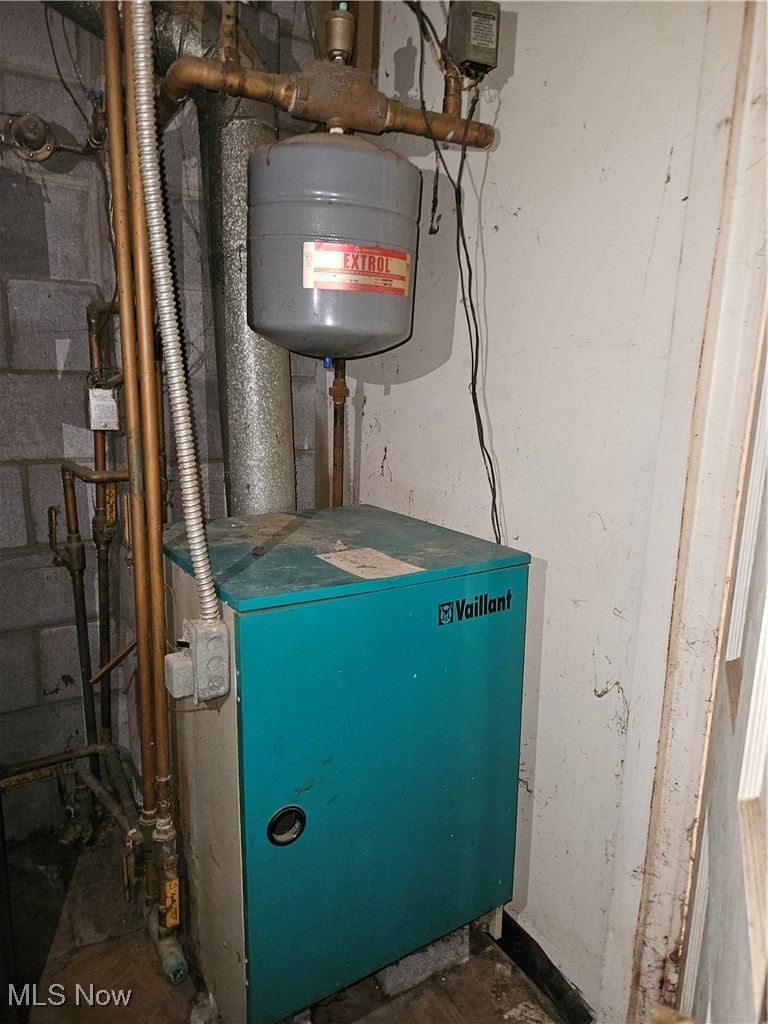 16940 Thompson Road Thompson, OH 44086 - Photo 17 of 30 Utility room featuring a heating unit