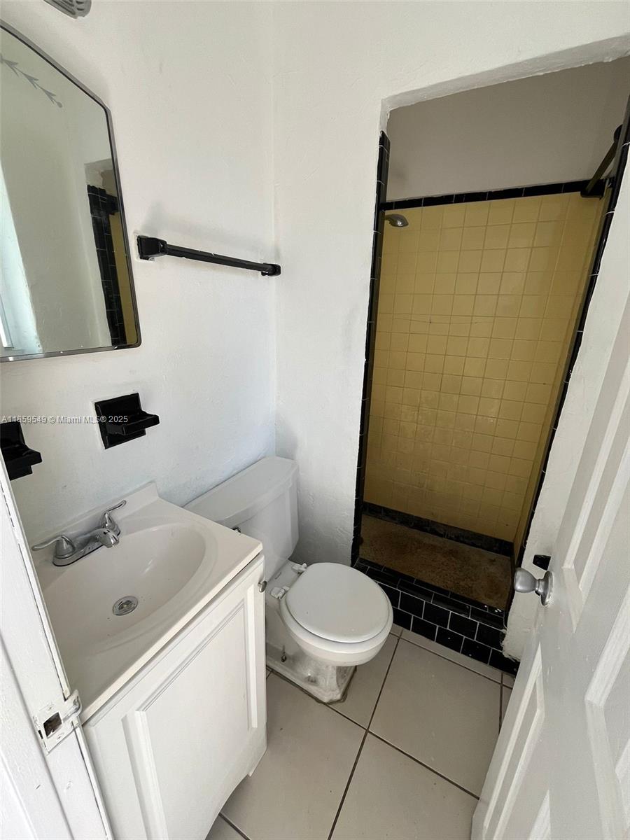 1915 Fletcher Street, Unit W4 Hollywood, FL 33020 - Photo 5 of 8 a bathroom with a sink toilet and shower