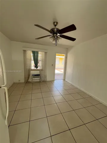 a view of an empty room and window
