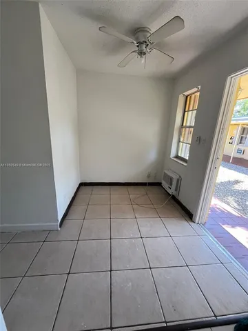 a view of an empty room with windows