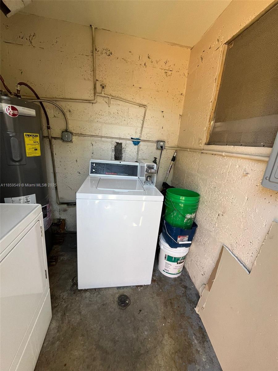 1915 Fletcher Street, Unit W4 Hollywood, FL 33020 - Photo 8 of 8 a utility room with dryer and washer