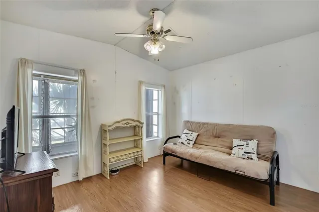 a living room with furniture and a window