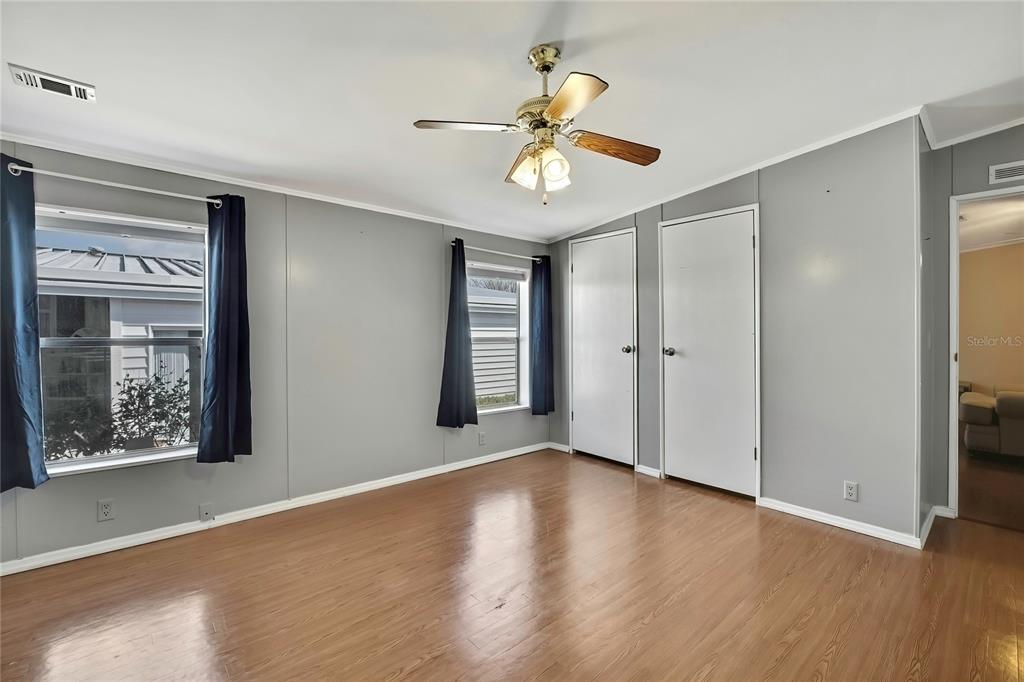 2400 Lemur Drive Holiday, FL 34690 - Photo 22 of 39 a view of an empty room with wooden floor and a window