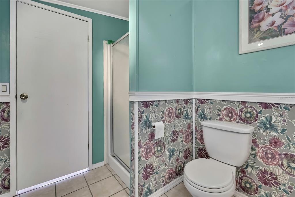 2400 Lemur Drive Holiday, FL 34690 - Photo 24 of 39 a bathroom with a toilet and a shower