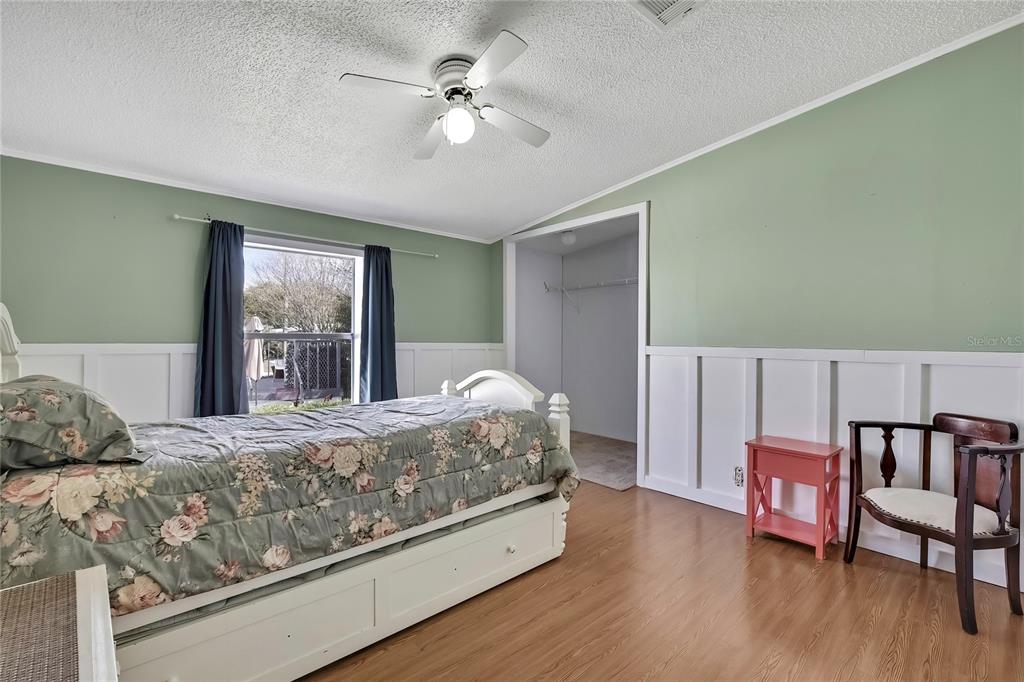 2400 Lemur Drive Holiday, FL 34690 - Photo 25 of 39 a bedroom with a bed furniture and a window