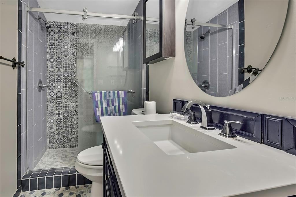 2400 Lemur Drive Holiday, FL 34690 - Photo 29 of 39 a bathroom with a sink toilet and shower