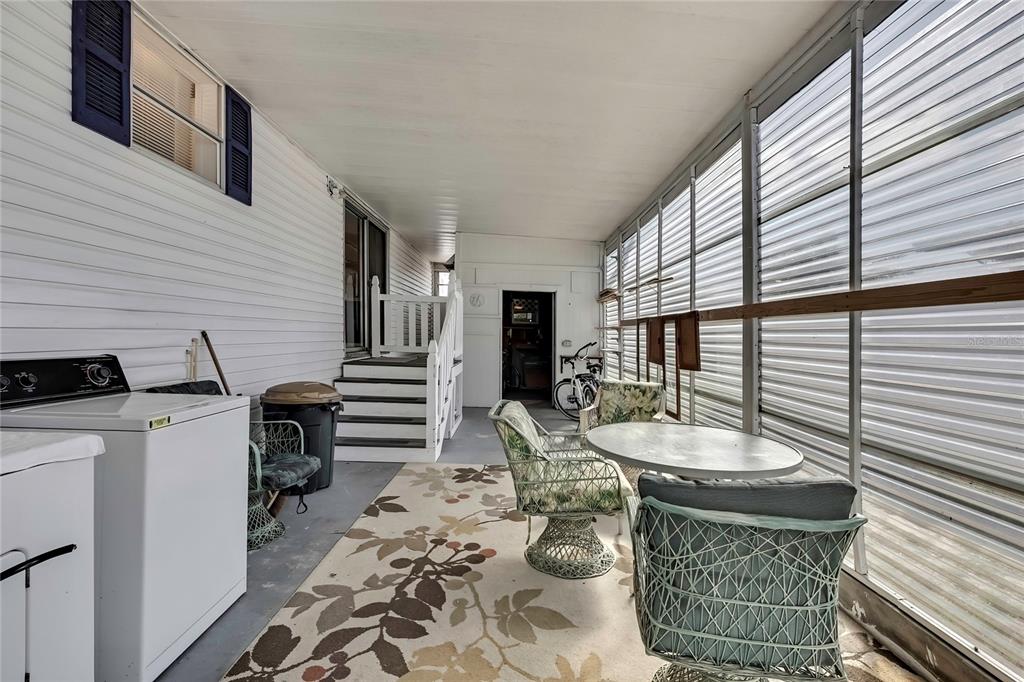 2400 Lemur Drive Holiday, FL 34690 - Photo 37 of 39 a view of a patio with table and chairs and couches