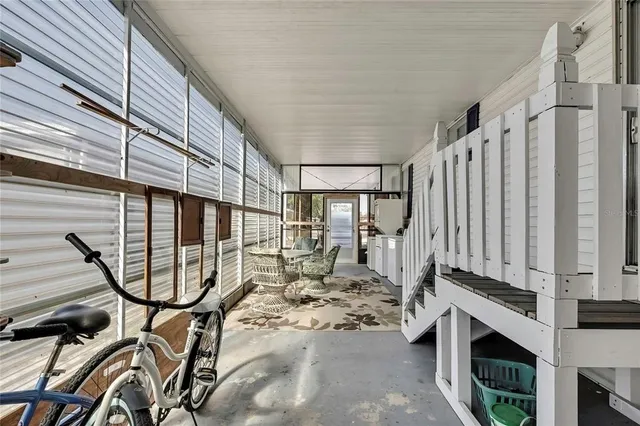 a view of an entryway with wooden floor