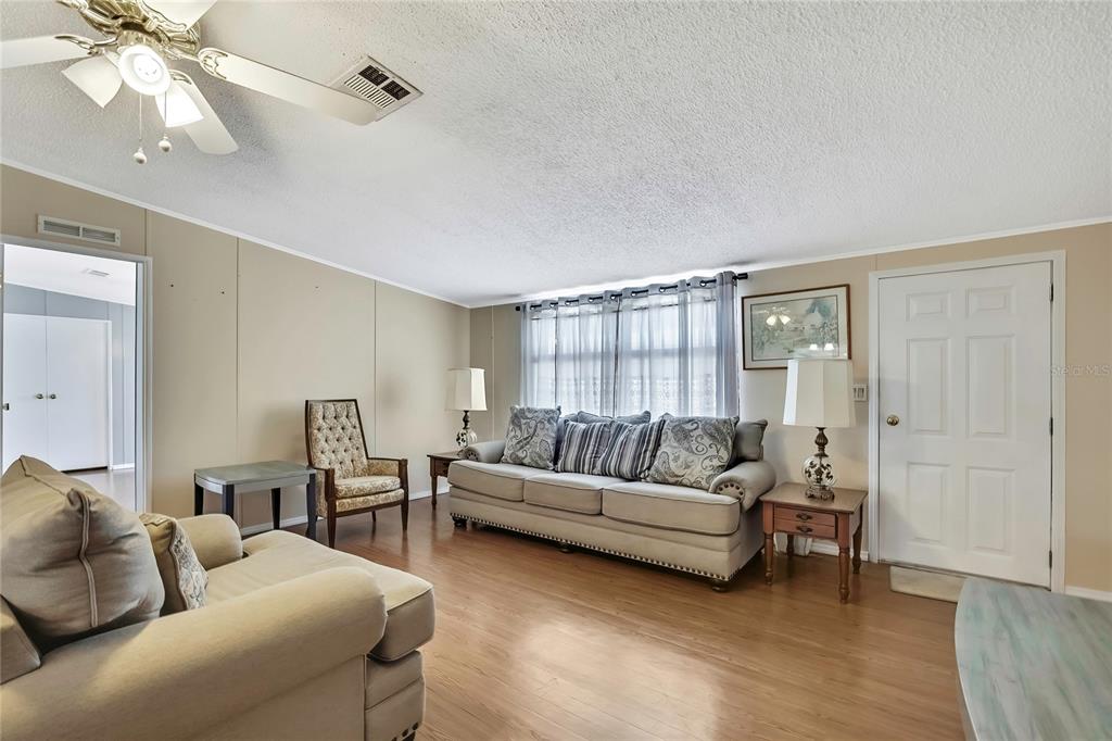 2400 Lemur Drive Holiday, FL 34690 - Photo 6 of 39 a living room with furniture and a large window