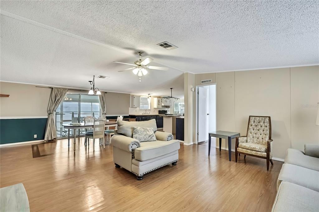 2400 Lemur Drive Holiday, FL 34690 - Photo 7 of 39 a living room with furniture and a wooden floor