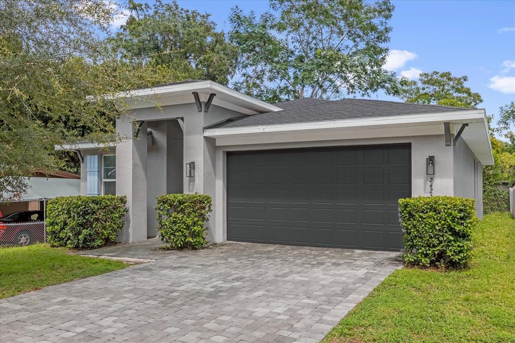 2425 Newberry Street Orlando, FL 32806 - Photo 1 of 1 a front view of a house with garden