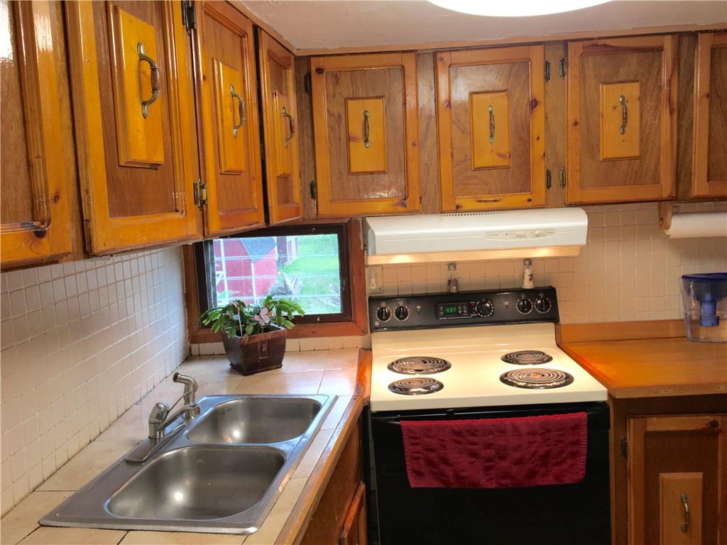 105 Plank Road Acme, PA 15610 - Photo 13 of 25 The stove is almost new with cabinets custom made by the owner's!