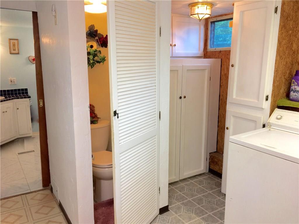 105 Plank Road Acme, PA 15610 - Photo 14 of 25 A nice sized Laundry Room with an extra toilet separate from the full Bathroom in the background.