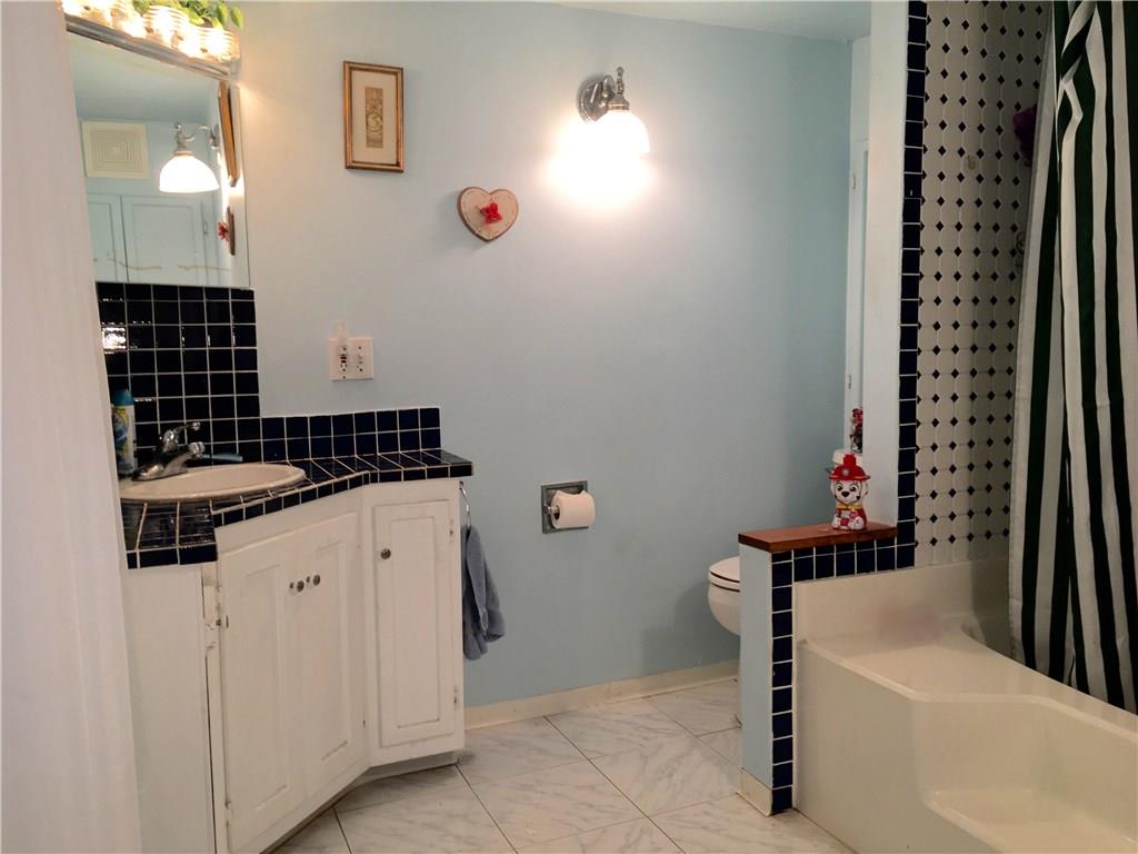 105 Plank Road Acme, PA 15610 - Photo 15 of 25 Full Bathroom with ceramic tile floor, and counter top on the corner vanity!