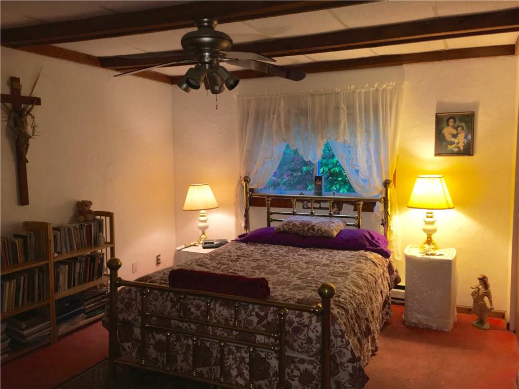 105 Plank Road Acme, PA 15610 - Photo 24 of 25 The owner's Bedroom is a nice size but the skill of the photographer (me) is lacking. Out of view are three closets and a wall with a full length dresser! The Bedrooms are located in a very quiet part of the home.