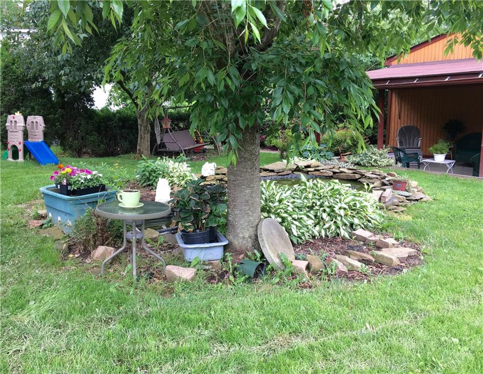105 Plank Road Acme, PA 15610 - Photo 5 of 25 Nice landscaping touches everywhere you look. Behind the tree is the gold-fish pond!