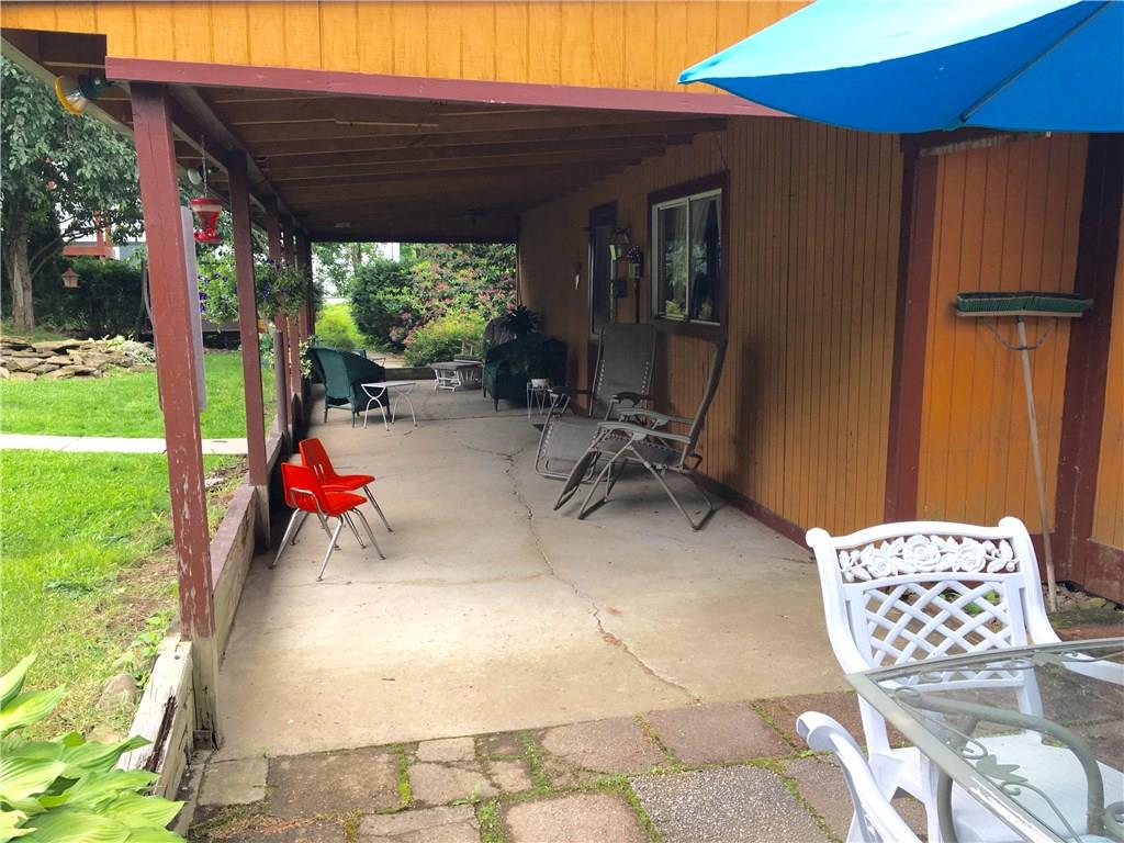 105 Plank Road Acme, PA 15610 - Photo 9 of 25 A reverse angle of the covered porch picking up a bit of the Patio in the forefront.