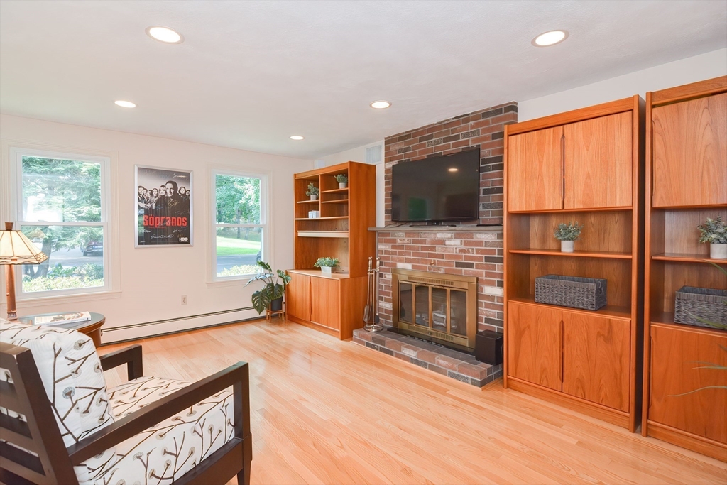 41 Eaton Road Framingham, MA 01701 - Photo 15 of 42 a living room with fireplace furniture and flat screen tv
