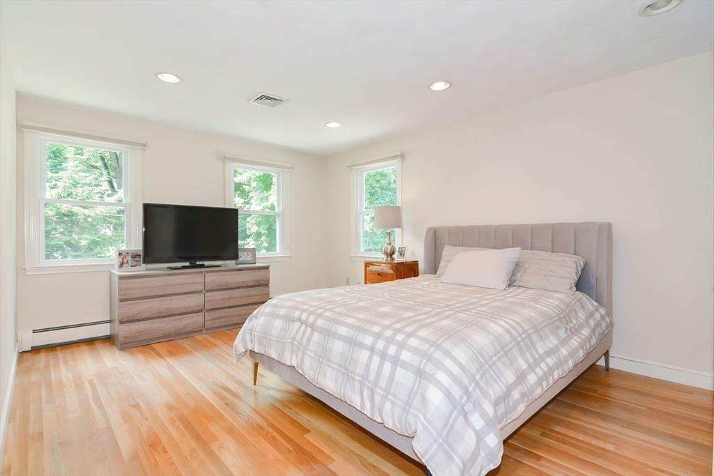 41 Eaton Road Framingham, MA 01701 - Photo 21 of 42 a bedroom with a bed and a flat screen tv