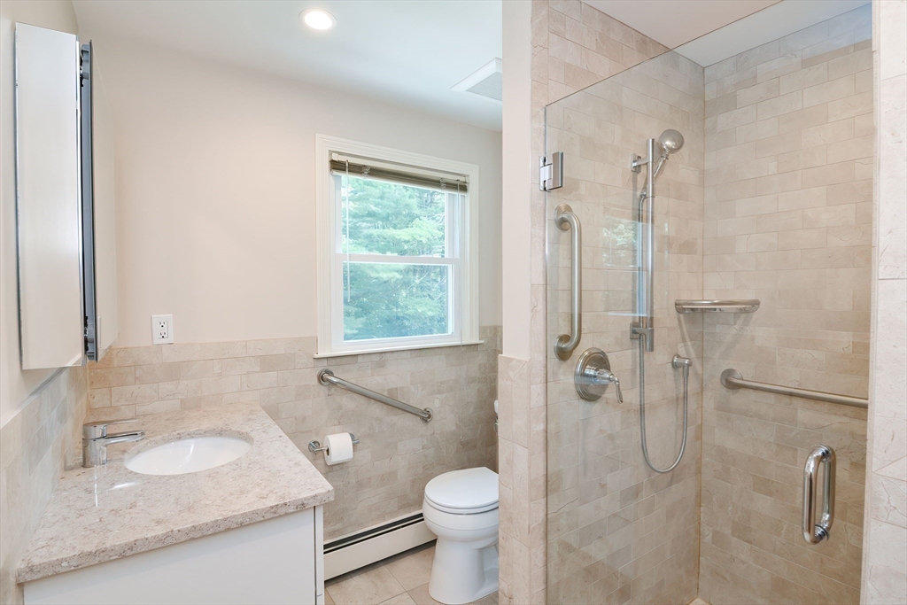 41 Eaton Road Framingham, MA 01701 - Photo 23 of 42 a bathroom with a granite countertop sink a toilet and shower