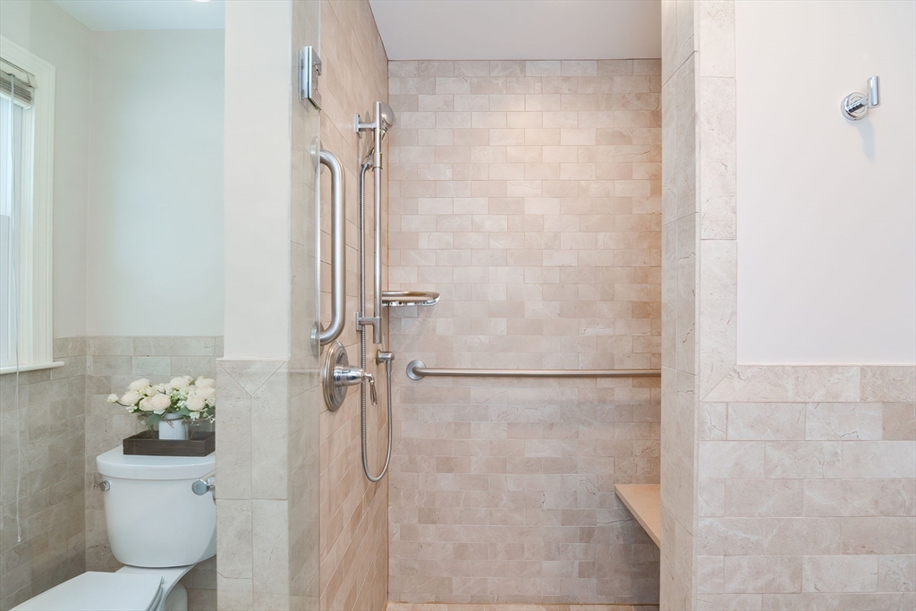 41 Eaton Road Framingham, MA 01701 - Photo 24 of 42 a bathroom with a shower toilet and sink