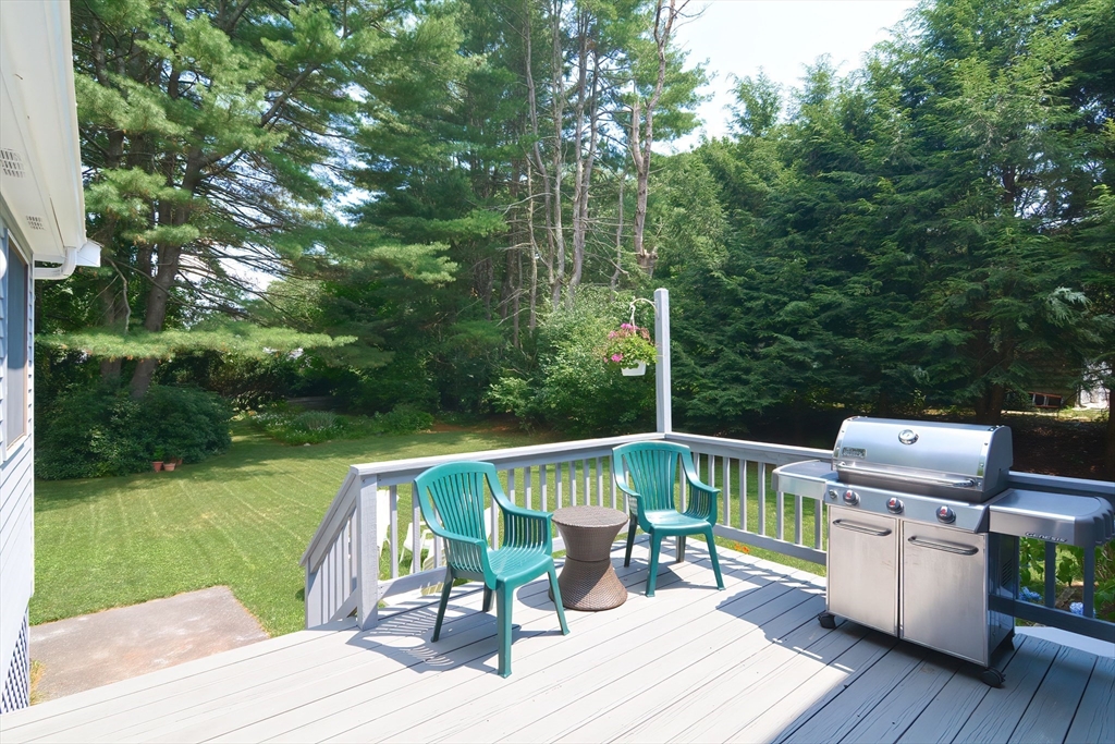 41 Eaton Road Framingham, MA 01701 - Photo 32 of 42 a view of deck with table and chairs wooden floor and fence