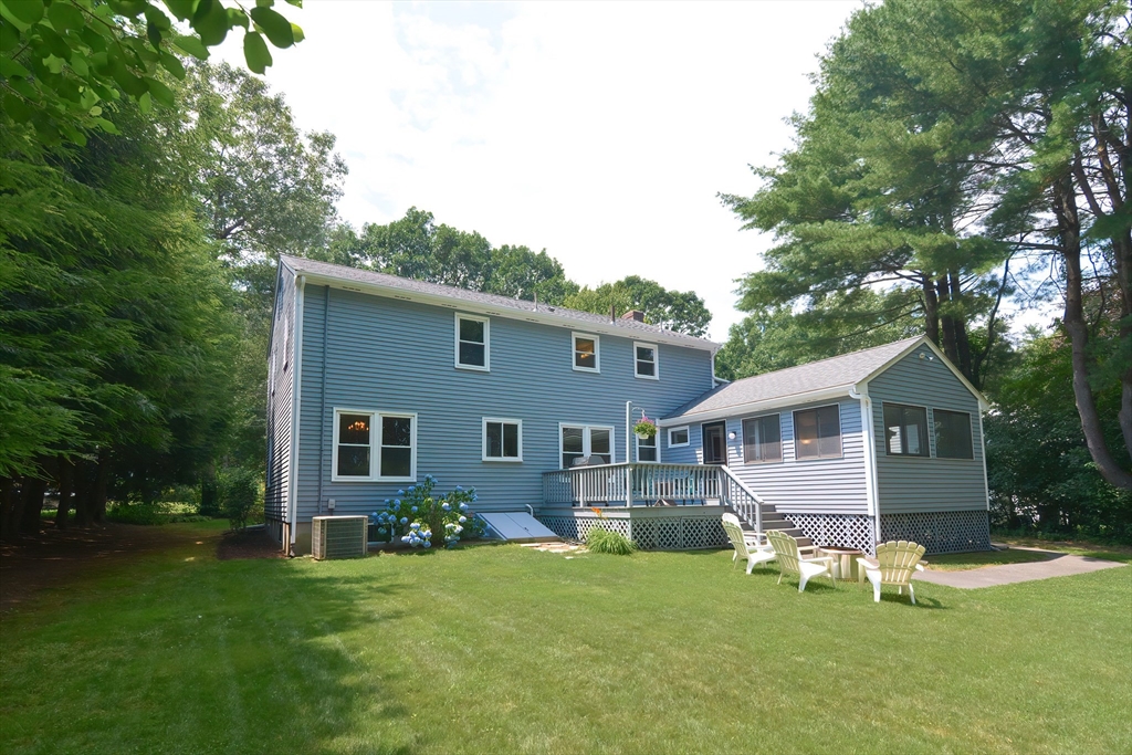 41 Eaton Road Framingham, MA 01701 - Photo 36 of 42 a front view of a house with a yard porch and outdoor seating